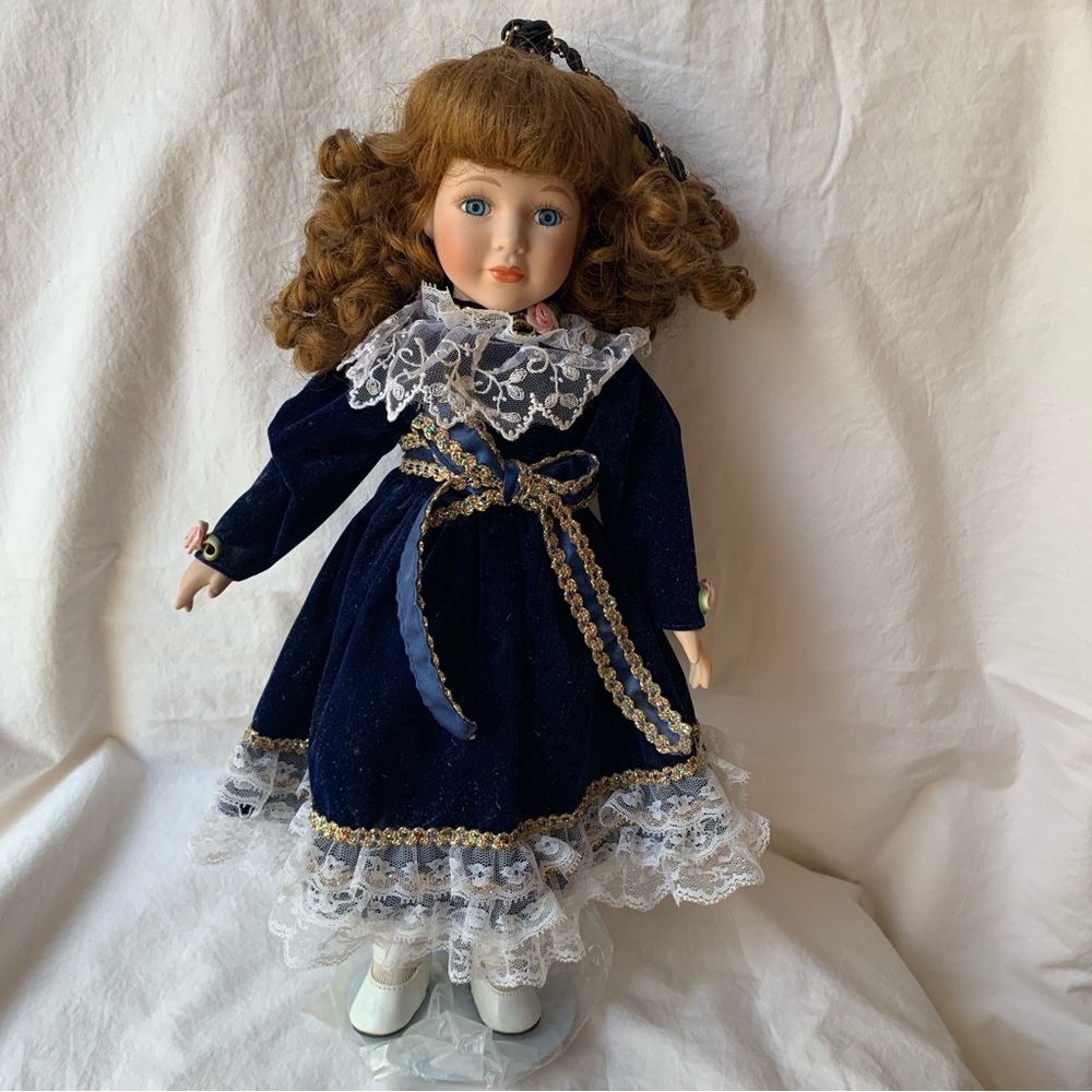 Classic Porcelain Doll in Navy Blue Dress with Lace